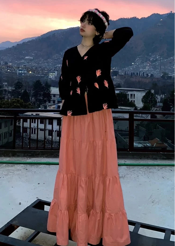 Black cotton Embroideredfusion shirt styled with a peach skirt for a fusion look