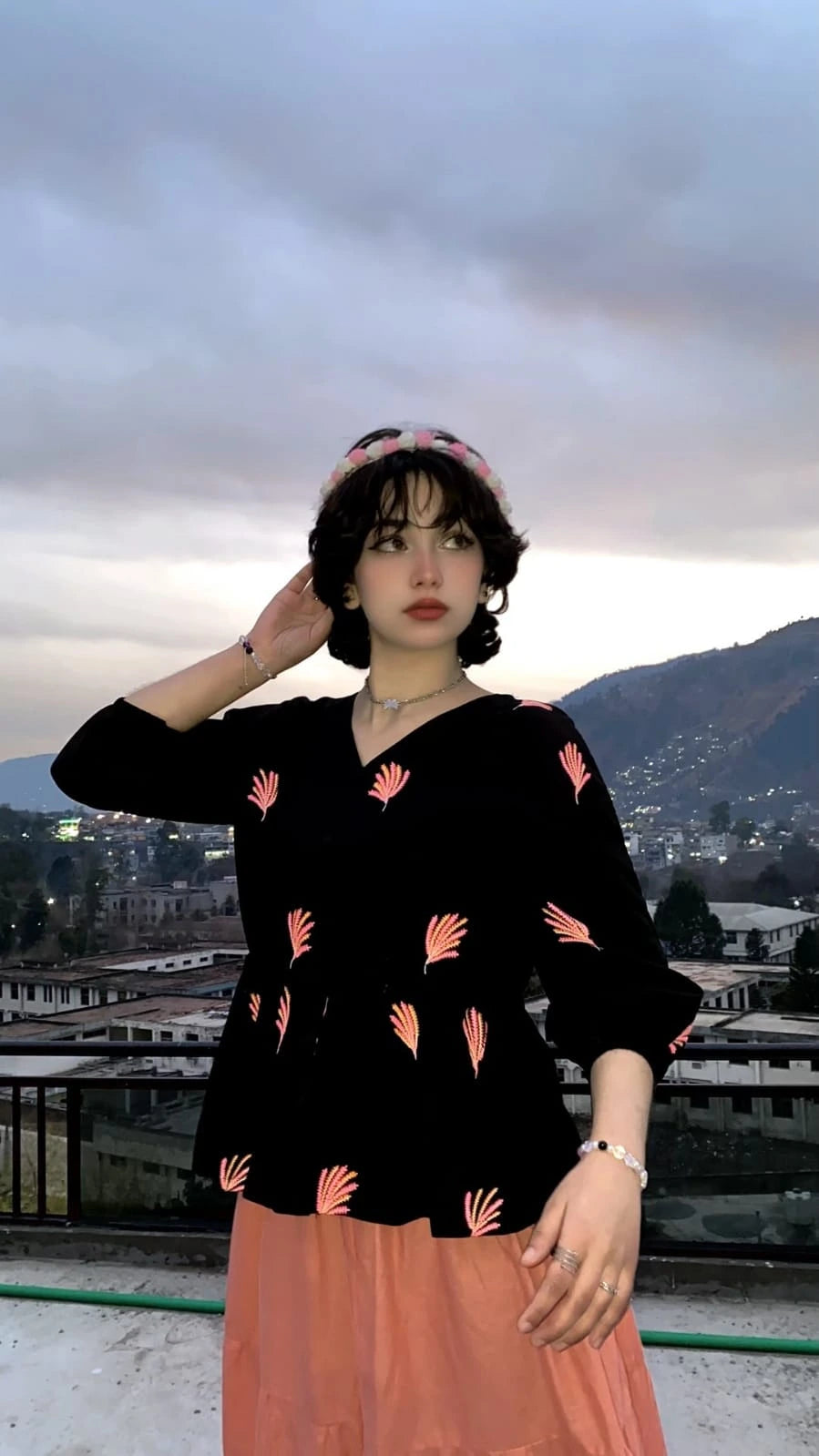 Black cotton Embroidered fusion shirt styled with a peach skirt for a fusion look