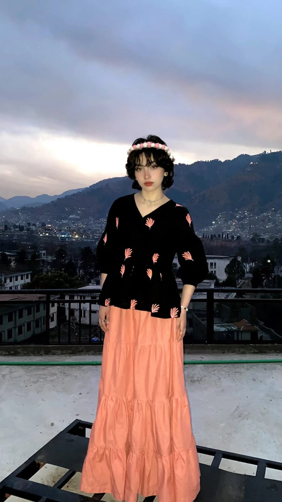Black cotton Embroidered fusion shirt styled with a peach skirt for a fusion lookd