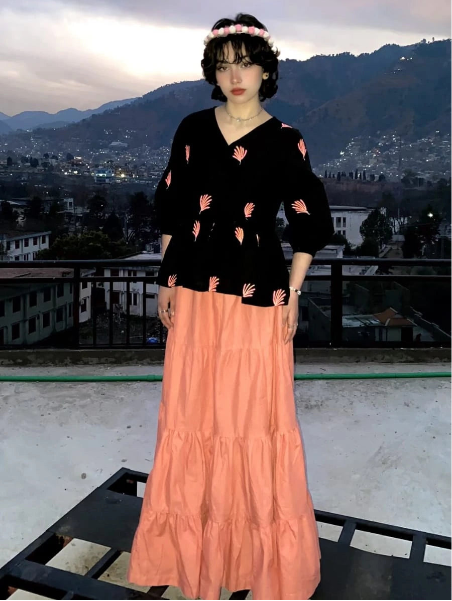Peach cotton tiered long skirt styled with fusion shirts for women